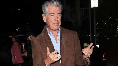 Photo of Pierce Brosnan looks smart in a brown suede blazer as he animatedly leaves a restaurant following a romantic dinner with wife Keely Shaye Smith